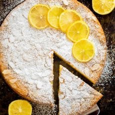 Almond cake recipe with lemon and a slice removed