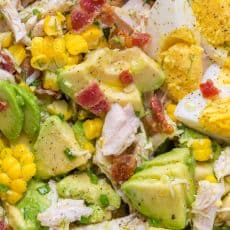 This Avocado Chicken Salad recipe is a keeper! Easy, excellent chicken salad with lemon dressing, plenty of avocado, irresistible bites of bacon and corn | natashaskitchen.com