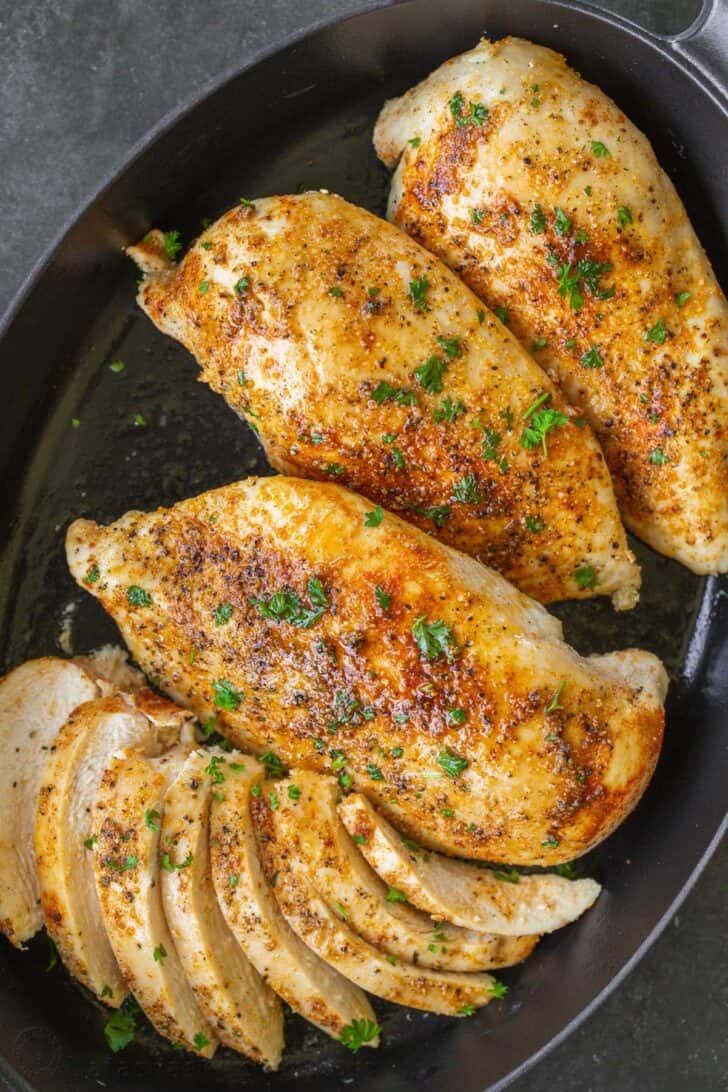 Baked chicken breast in a pan. 