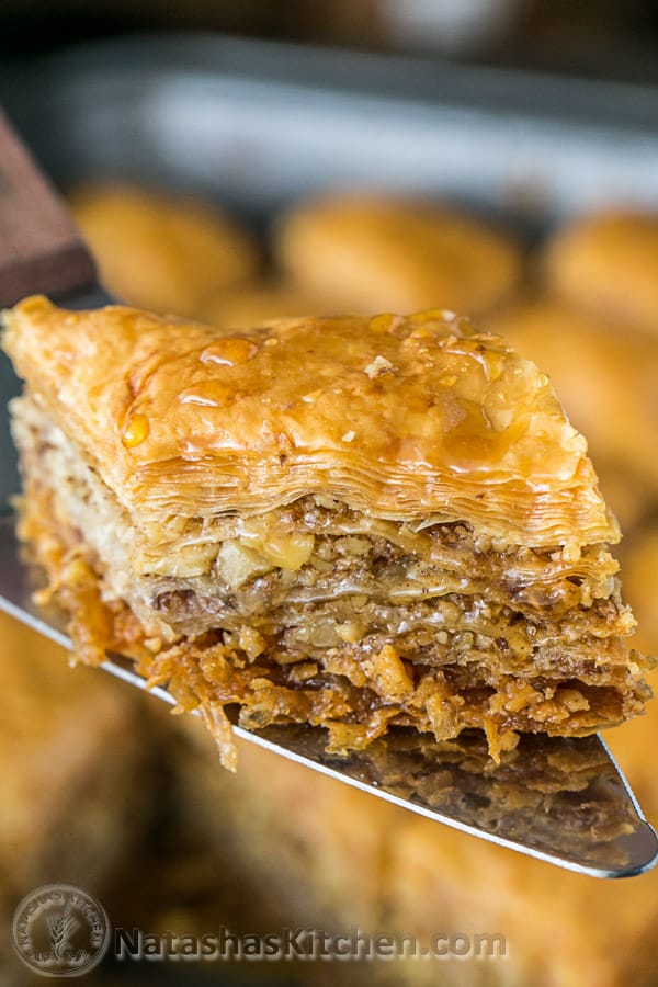 Slice of baklava coming out of serving pan for baklava and how to cut baklava