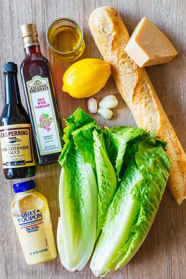 Ingredients for caesar salad with romaine lettuce, crouton ingredients, and caesar salad ingredients