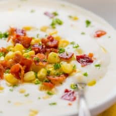 This creamy cauliflower soup is loaded with sweet corn and crunchy bacon. Creamy cauliflower soup has rich gourmet flavor and it's good for you! | natashaskitchen.com