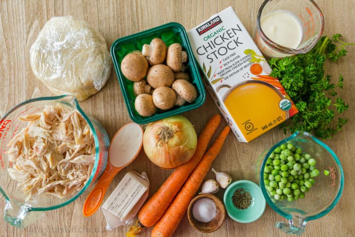 Ingredients for chicken pot pie with chicken, mushrooms, carrot, onion