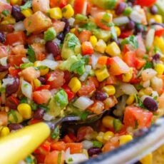 Cowboy caviar ingredients in a large bowl ready to serve with a spoon