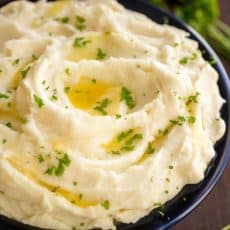 These creamy mashed potatoes are shockingly good! Learn the secrets to the best mashed potatoes recipe. Whipped, velvety and holiday worthy mashed potatoes! | natashaskitchen.com
