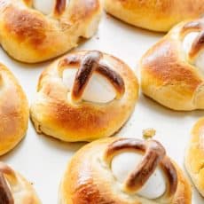 This Easter Breads recipe produces a billowy soft, golden and lightly sweet Easter bun with a perfectly cooked egg. Beautiful way to share the Easter story!