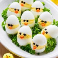 Easy and fun Easter Egg Recipe. A creative spin on traditional dressed eggs. Deviled egg chicks were the talk of my kitchen - the cutest Easter chicks! | natashaskitchen.com