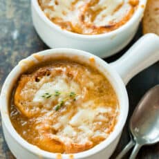 French Onion soup served in bowls with toasted breads