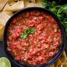 Fresh homemade salsa in a bowl with tortilla chips