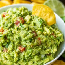 authentic guacamole loaded with avocados, tomato, onion, cilantro, plenty of lime juice, salt and pepper.