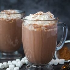 homemade hot chocolate in mugs with whipped cream