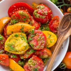 Easy marinated tomatoes recipe with so much flavor! Makes store-bought tomatoes taste WAY better! Marinated tomatoes keep well refrigerated up to 1 week | natashaskitchen.com