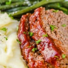 Amazing homemade Meatloaf Recipe. The meatloaf is so tender and juicy on the inside with a sweet and tangy sauce that glazes the meatloaf and adds so much flavor!