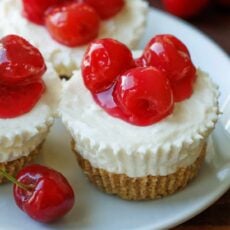 No bake mini cheesecakes with cherry topping on plate