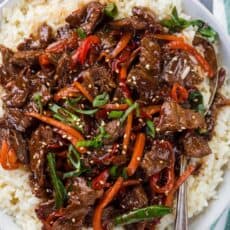 Mongolian beef and vegetables over white rice