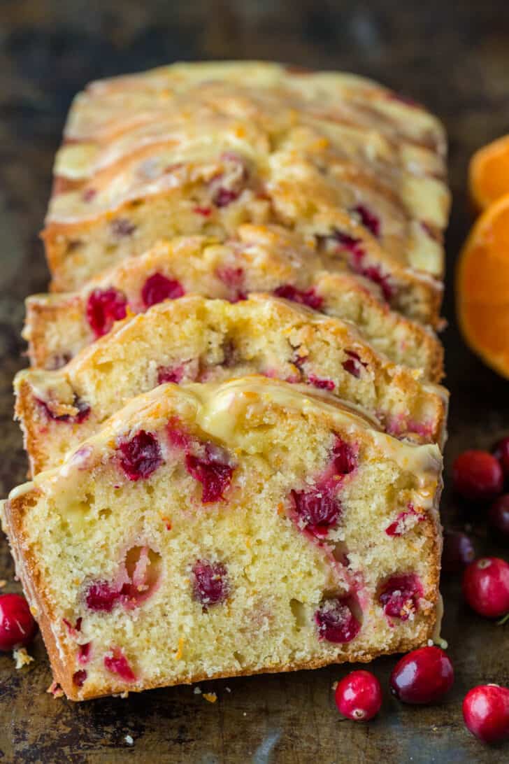 Sliced cranberry bread with fresh cranberries