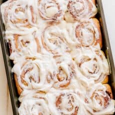 Melt-in-you-mouth overnight cinnamon rolls with whipped cream cheese icing. Perfect for holidays and busy mornings. The best make-ahead cinnamon rolls! | natashaskitchen.com