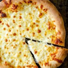 Pizza dough baked with cheese and white sauce