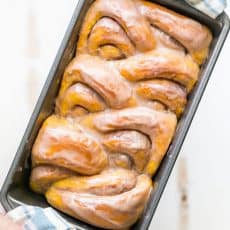 You'll make this Pumpkin Bread over and over. Cinnamon rolls + pumpkin pie + amazing cinnamon glaze = this pull-apart pumpkin bread! It melts in your mouth! | natashaskitchen.com