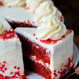 Red Velvet Cake sliced with one piece being served