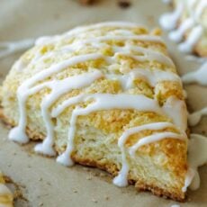 Classic baked scones drizzled with vanilla glaze, cut into wedges