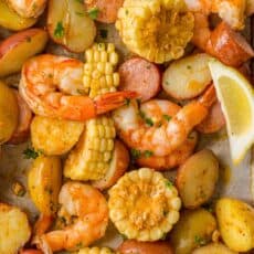 Shrimp Boil Recipe on Sheet Pan with lemon wedges