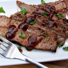 A white plate with spice-rubbed sirloin cut