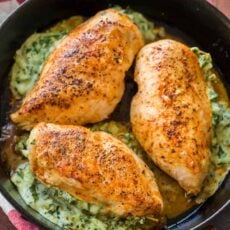 Spinach stuffed chicken breasts in skillet