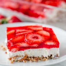 This strawberry pretzel salad is always a hit at parties. It's a strawberry jello dessert that is dangerously good! It's sweet, salty, tart and irresistible!