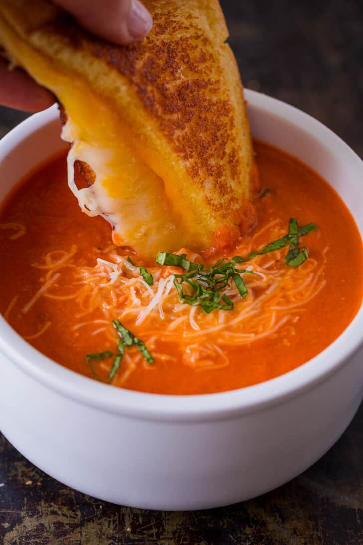 Serving tomato soup with a grilled cheese sandwich