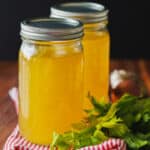 Easy-to-make homemade turkey stock recipe stored in glass mason jars