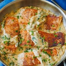 Tuscan salmon in cream sauce served in skillet